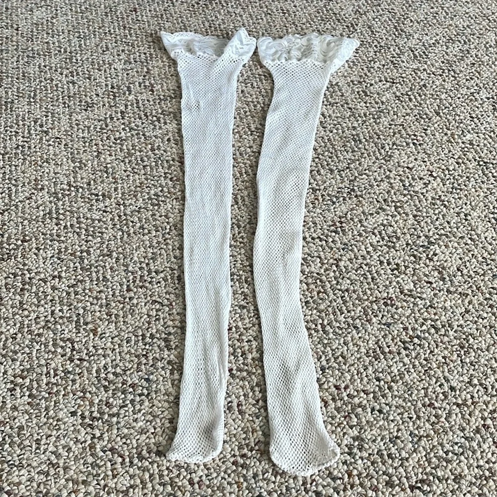 Pair Of Mismatched Fishnet Thigh High’s